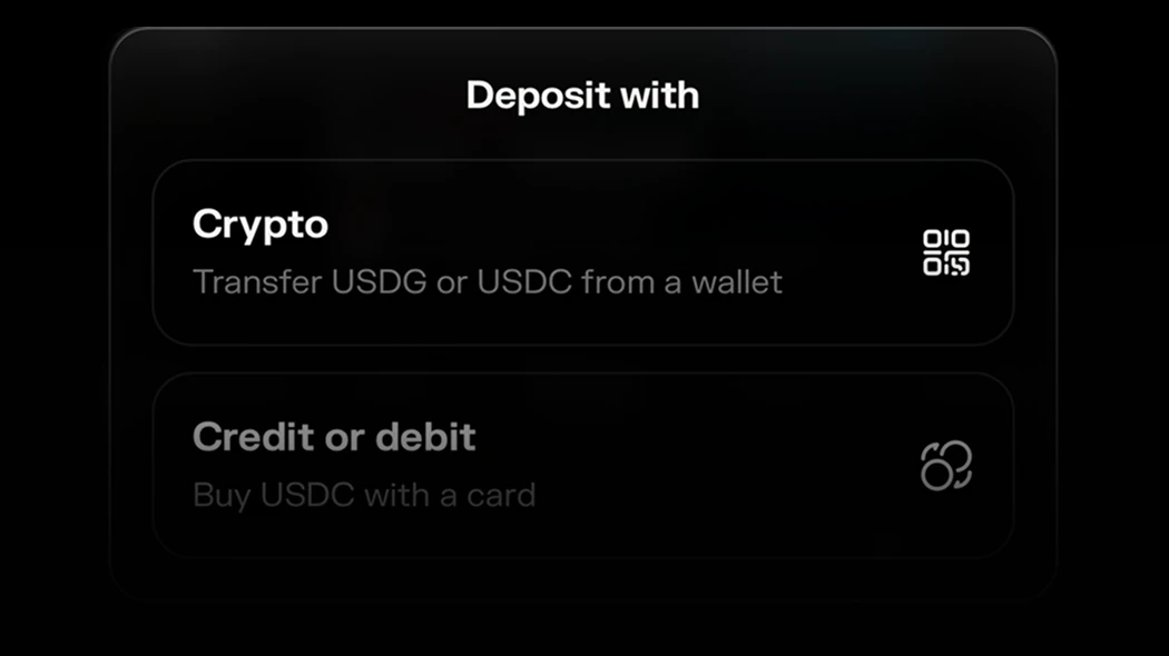 The deposit sheet, headed Deposit with: a Crypto row for transferring USDG or USDC from a wallet, and a fading Credit or debit row for buying USDC with a card.